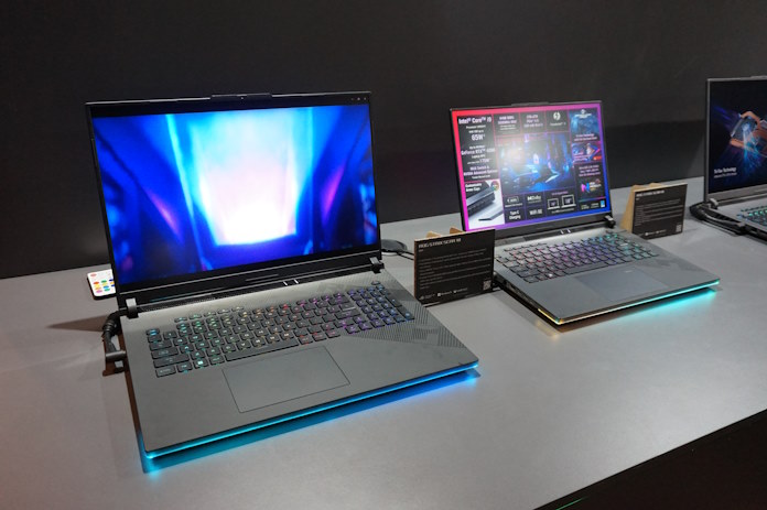 ROG Strix SCAR 18 and SCAR 16 laptops on a display table 