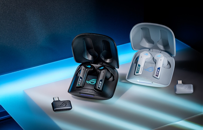 The ROG Cetra Speednova gaming earbuds, in black and blue, sitting on a table