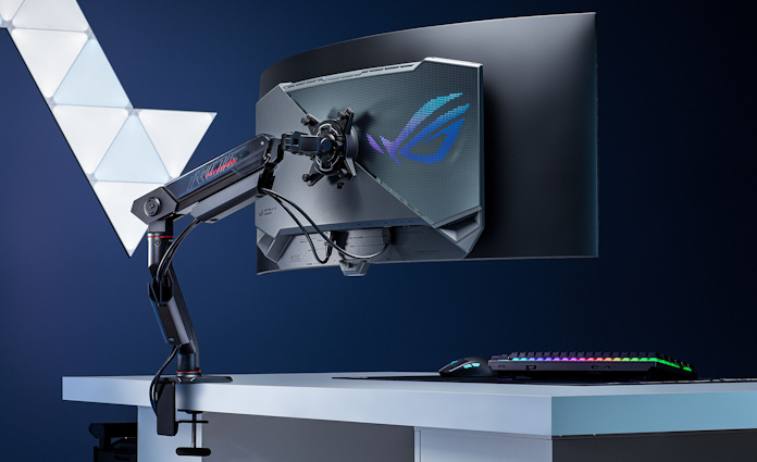The ROG Ergo Arm creating a clean, open gaming setup on a desk 