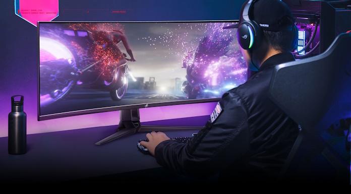 A gamer playing using the ROG Swift OLED PG49WCD ultrawide gaming monitor