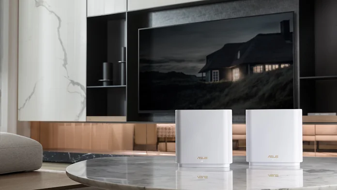 ZenWiFi XT8 mesh routers on an end table in a living room