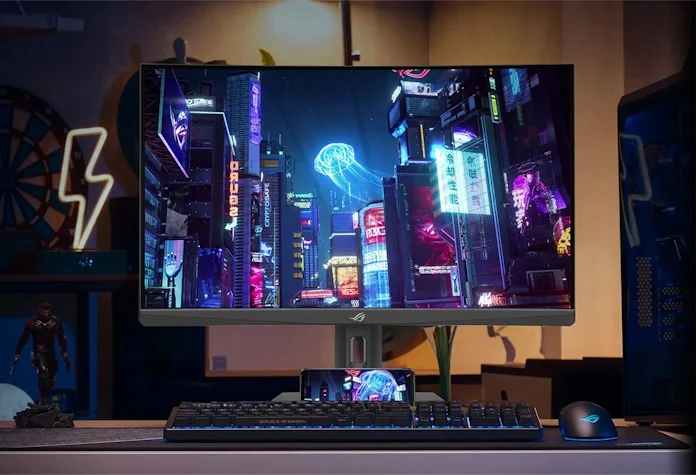 A gaming setup featuring an ROG Strix gaming monitor