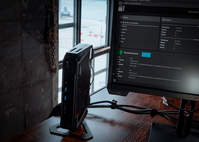 An ASUS NUC 14 Performance Mini PC on a desk in a production studio 