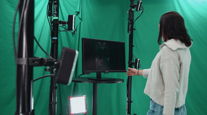 A woman interacting with the on-set monitor 