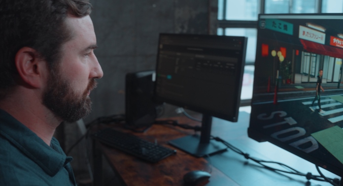 A man editing video with the ProArt Display PA32UCXR