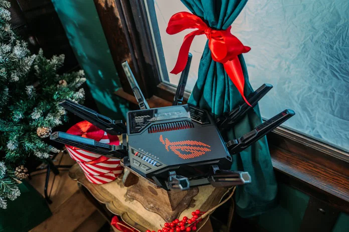 The ROG Router GT-BE98 Pro router in a festive room 