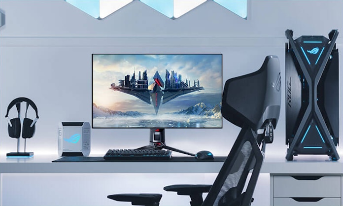 The ROG Swift OLED PG32UCDP gaming monitor in a full ROG gaming setup 