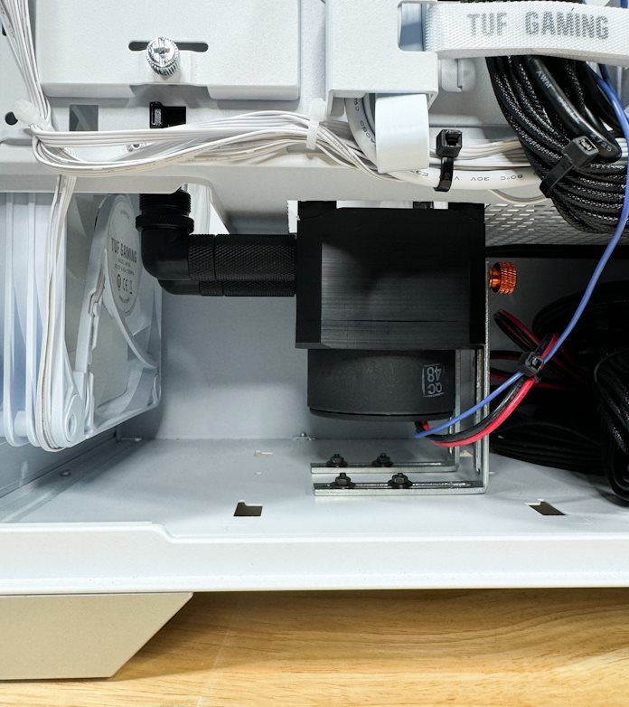 The liquid cooling elements hidden underneath the PSU shroud