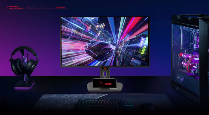 The ROG Strix OLED XG27ACDNG gaming monitor on a desk with other ROG gear 