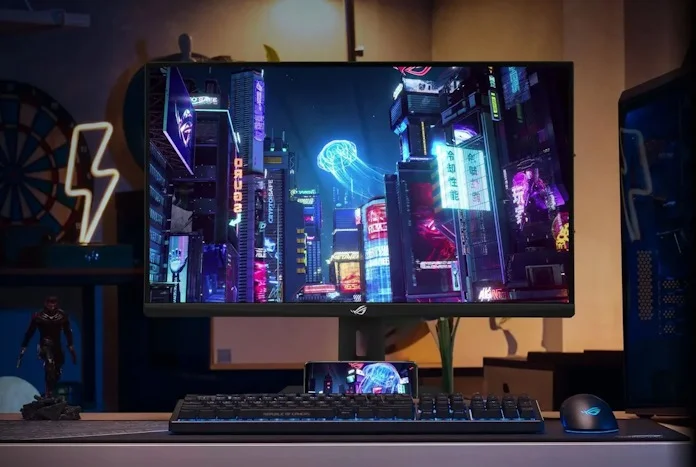 The ROG Strix XG27UCS 4K gaming monitor on a desk with other ROG gear