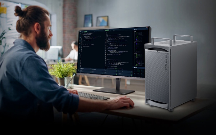 A man using the ExpertCenter Pro ET900N G3 AI supercomputer