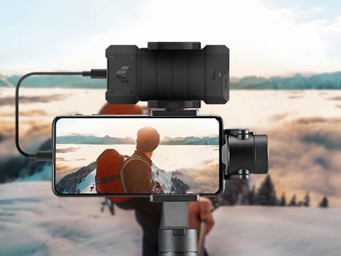 A traveler using a TUF Gaming A2 to record video