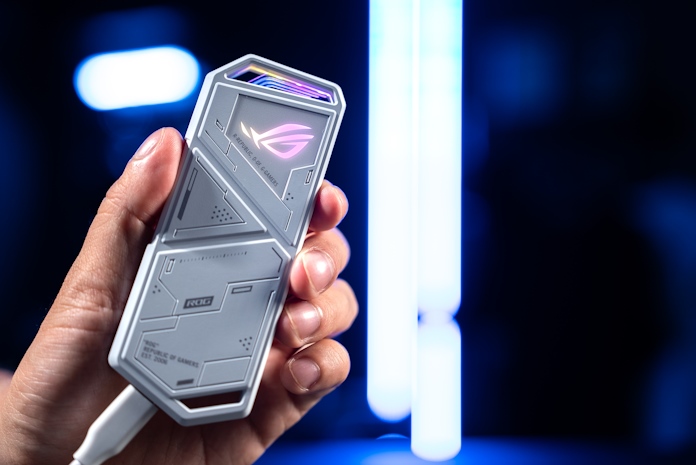 A man holding the ROG Strix Arion portable SSD enclosure