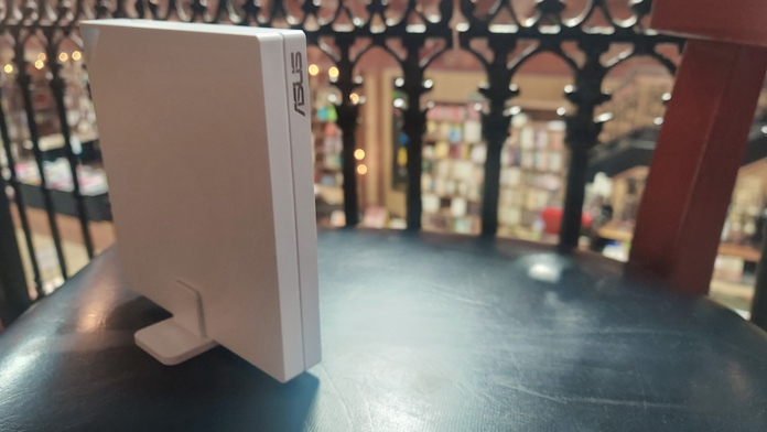 This travel router sitting on a chair in the upper level of a used bookstore