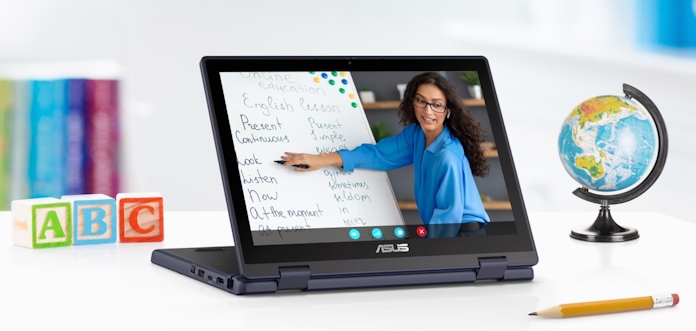 An ASUS laptop for education on a desk while a teacher does remote instruction