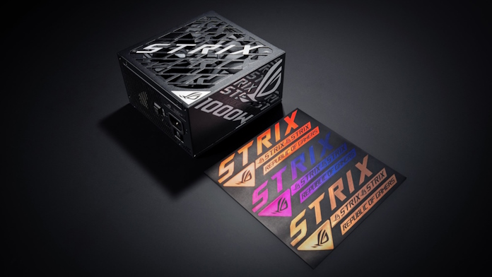 The ROG Strix 1200W Platinum power supply with its bundled sticker selection
