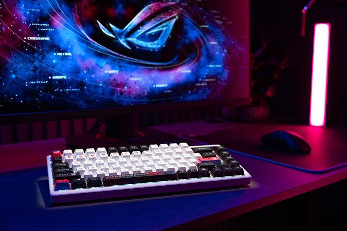 An ROG Azoth X custom gaming keyboard in a full PC setup 