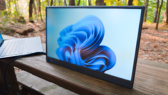 An ASUS ZenScreen portable monitor plugged into a laptop