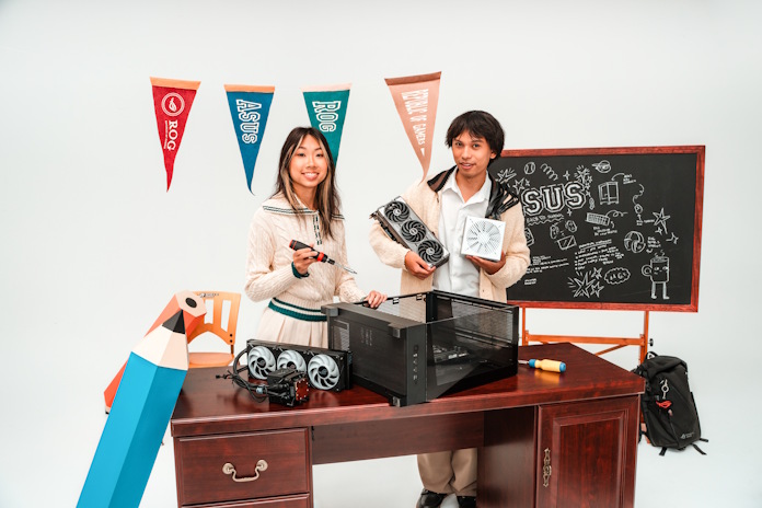 Two young people building a PC together
