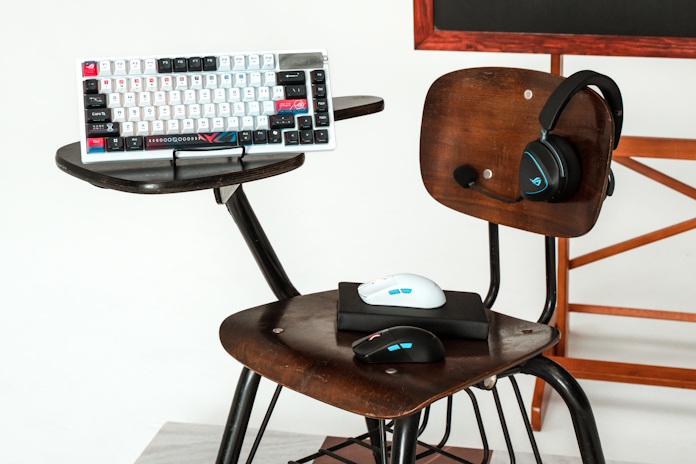 A variety of ROG peripherals on a school chair