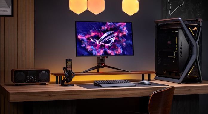 The ROG Swift OLED PG27UCDM gaming monitor as part of a full desktop gaming PC setup