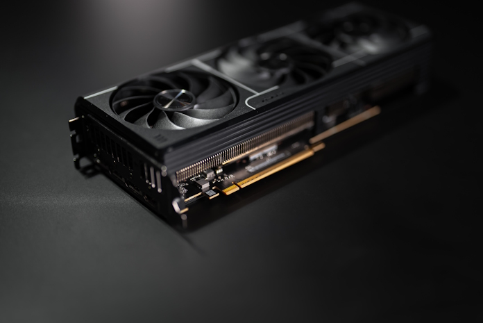 An ASUS Prime graphics card lying on its side on a table