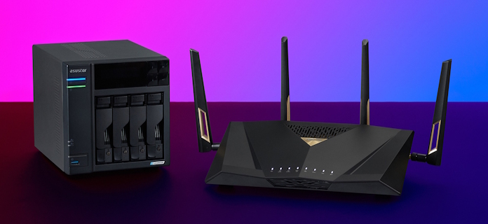 The ASUS RT-BE88U router on a table with an ASUSTOR NAS 