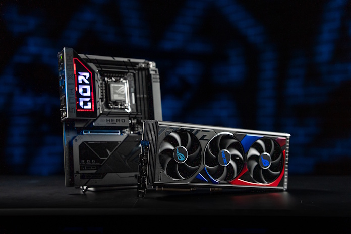 The ROG Maximus Z890 Hero BTF motherboard on a table next to the ROG Strix GeForce RTX 4090 BTF graphics card