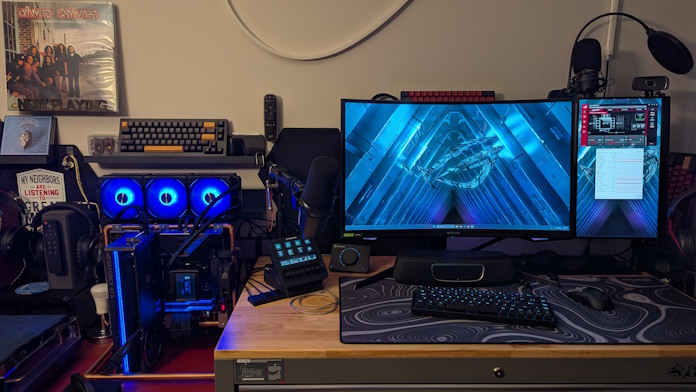 A front-facing view of a complete PC gaming setup in a garage