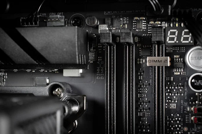 A view of the headers and DIMM slots on the top edge of the ROG Crosshair X870E Apex motherboard