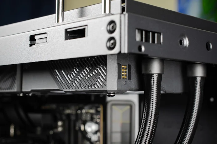 A view of the radiator and its fans installed in the top panel of a PC case