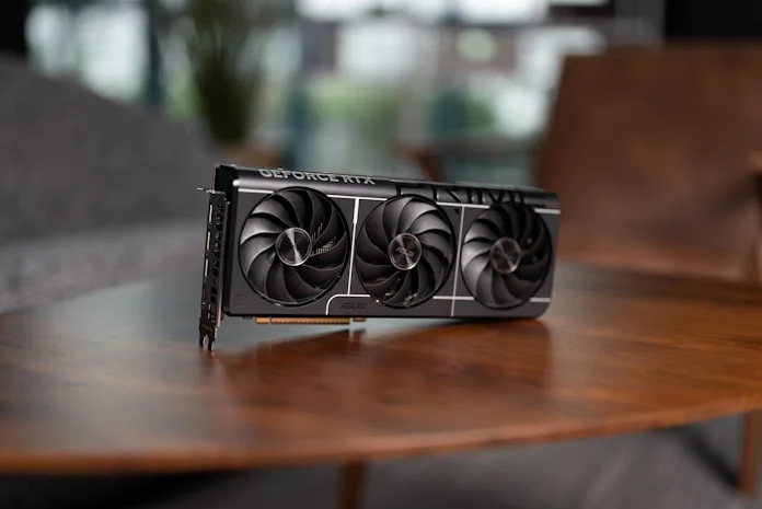 An ASUS Prime graphics card on an end table
