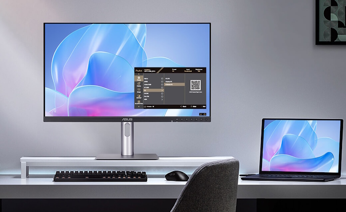 A workstation setup with an ASUS laptop and a ProArt display