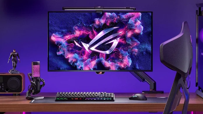 An ROG gaming setup featuring a monitor arm