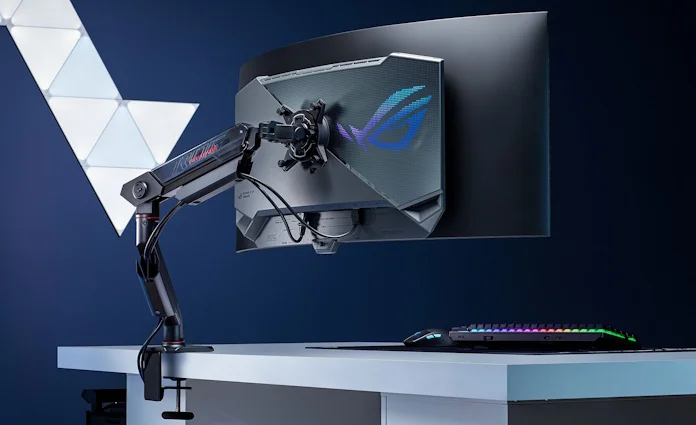 A monitor arm attached to a curved ultrawide ROG OLED gaming monitor