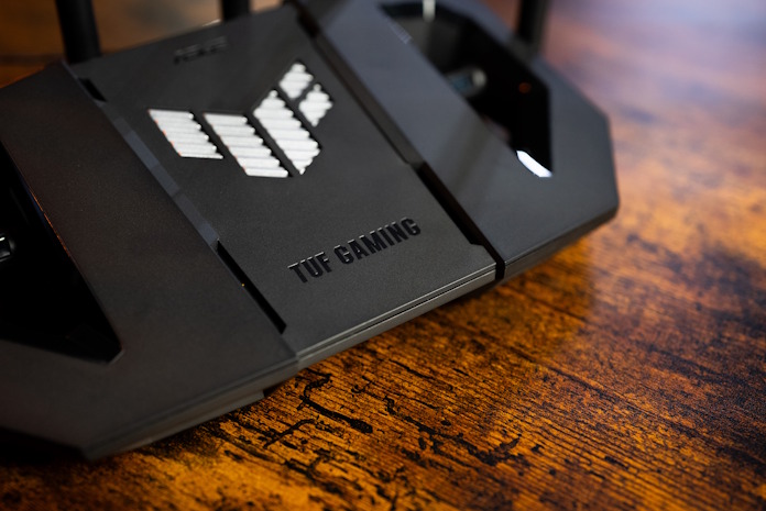A view of a TUF Gaming router on a wood table