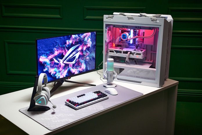 A complete ROG gaming setup with a white color them on a desk 
