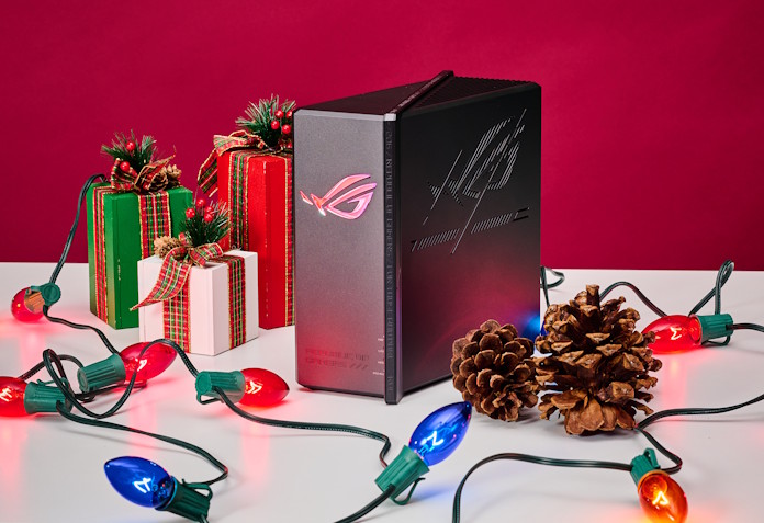 The ROG Strix GS-BE18000 wireless gaming router on a table with holiday lights and decorations
