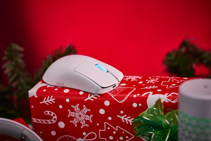 The ROG Harpe II Ace gaming mouse in white with holiday decorations