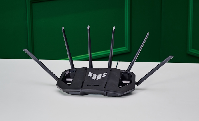A TUF Gaming wireless router on a white table